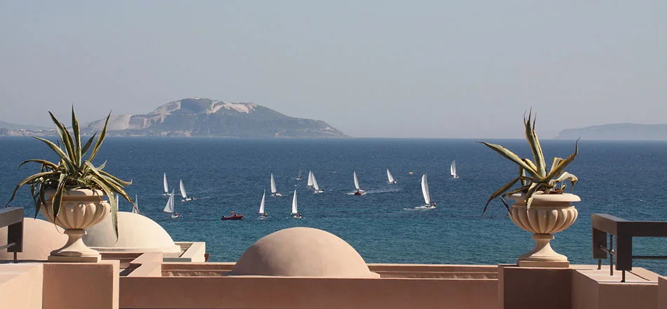Sailboats on the sea viewed from a terrace in Kos, Greece.