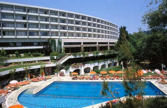 The curved hotel building and swimming pool at Corfu Holiday Palace.