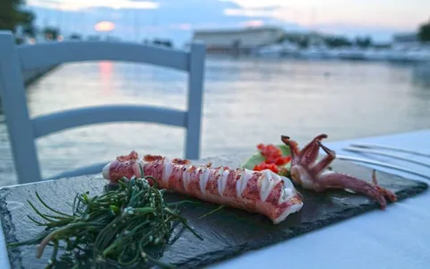 A seafood dish on a waterfront restaurant table at Porto Carras, Chalkidiki.
