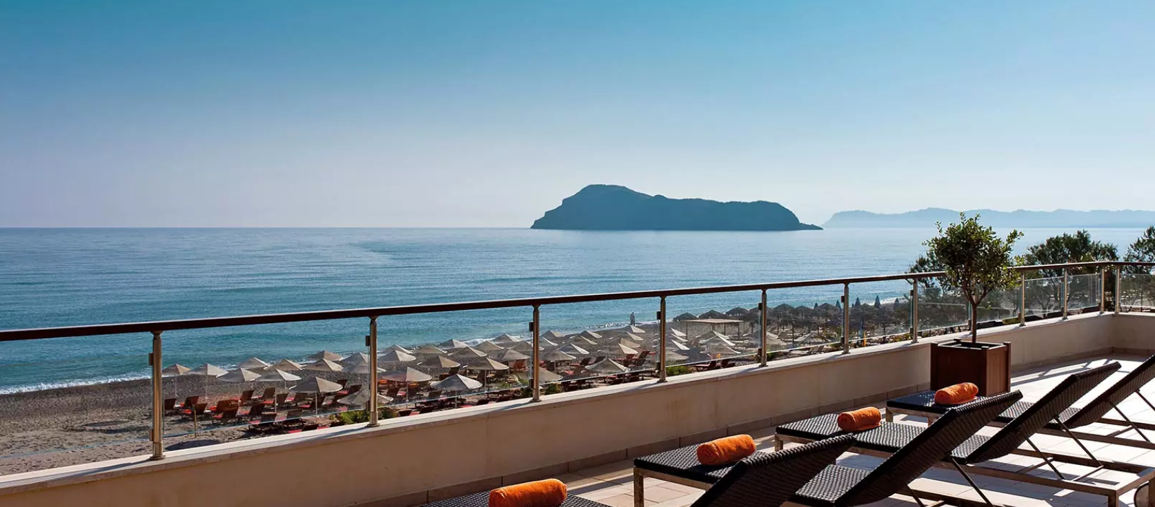 The sea and island beyond the terrace at Minoa Palace Resort in Crete